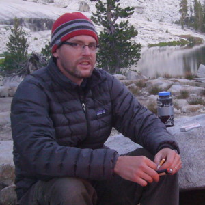 Adam sitting in camp